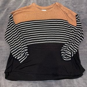 Tan, black and white blouse.